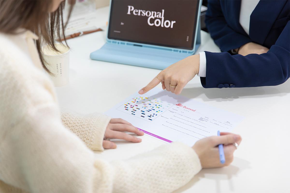 Enjoying a comprehensive color analysis session at The Bom in Myeongdong, featuring a professional and detailed questionnaire to understand your unique color palette.