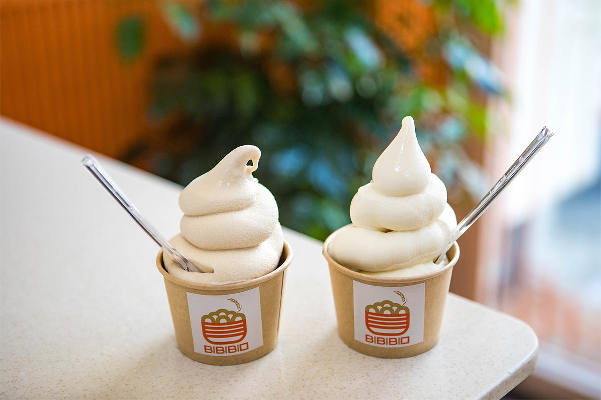 Two cups of creamy soft-serve ice cream from BIBIBIM cafe, perfect for a sweet treat during a visit to Gamcheon Culture Village in Busan.
