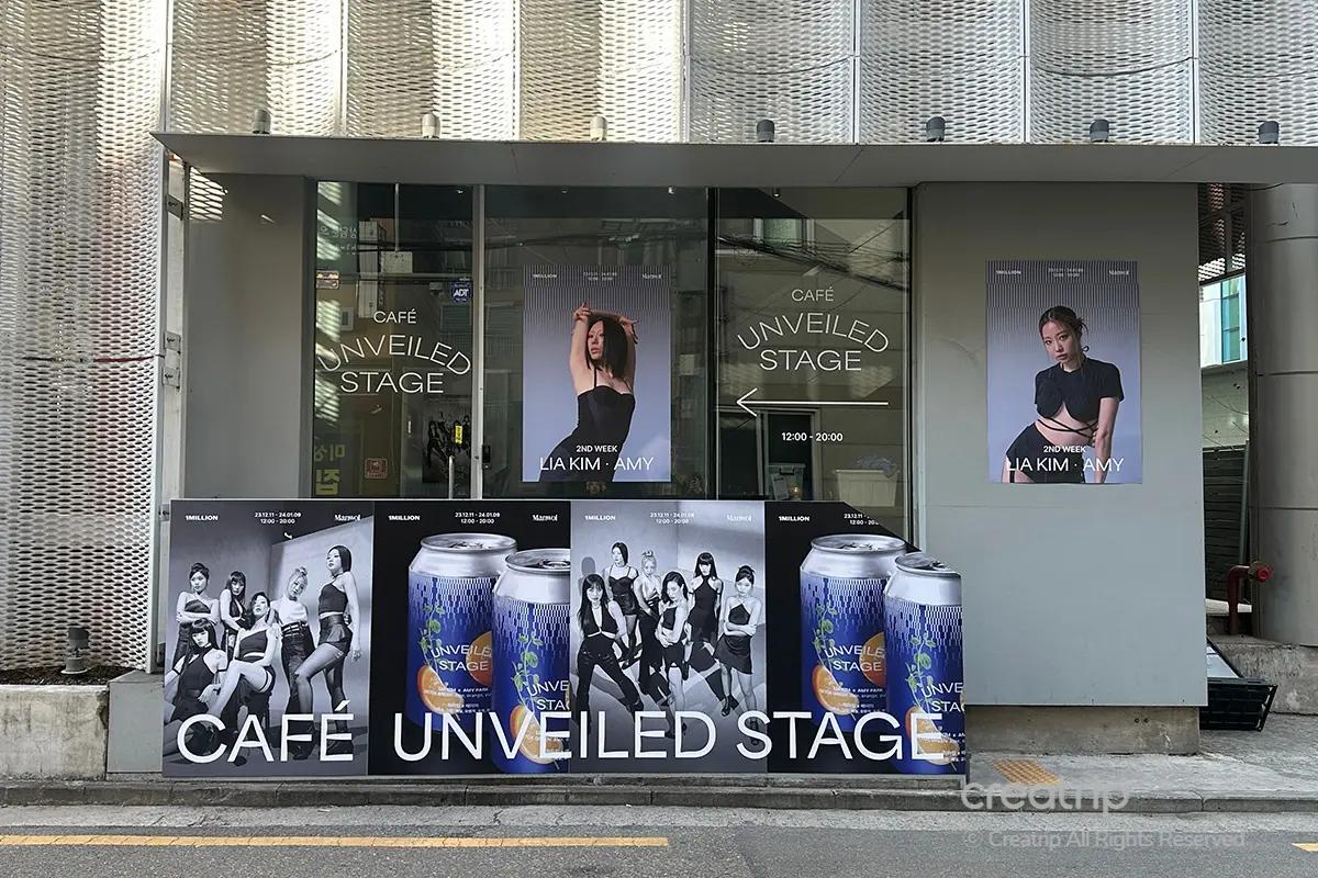 1MILLION舞蹈工作室前展示的各種海報和飲品廣告，展示舞者的照片和時刻表。