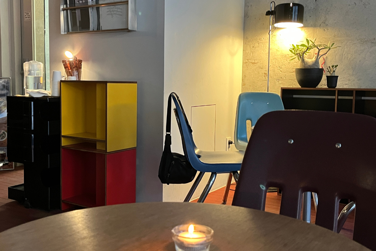 Cozy interior with minimal lighting creating a romantic atmosphere at Furoa cafe.