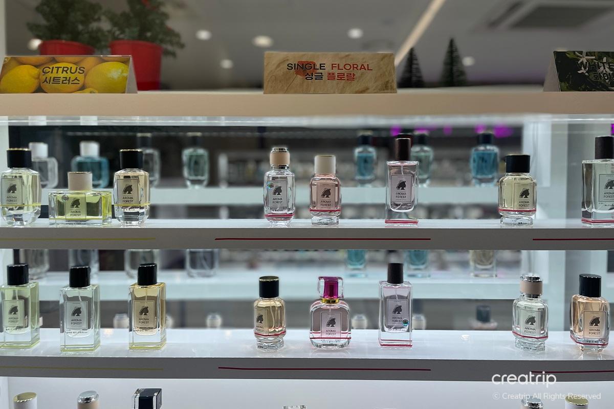 Women exploring fragrance options at Perfume Play Gangnam, engaging with the process of finding a personalized scent.