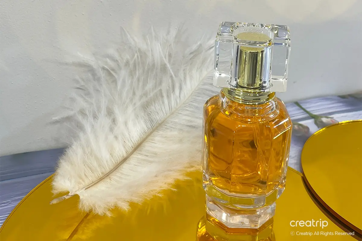 Elegantly styled Aroma Forest perfume held over a newspaper setup at Perfume Play Gangnam.