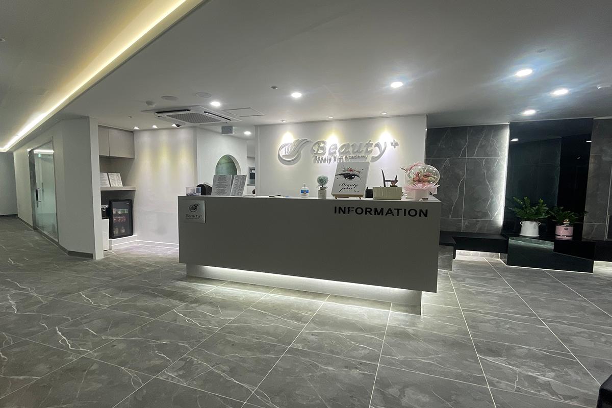 Front desk area of KoResQ beauty academy, with modern interior design and information desk.