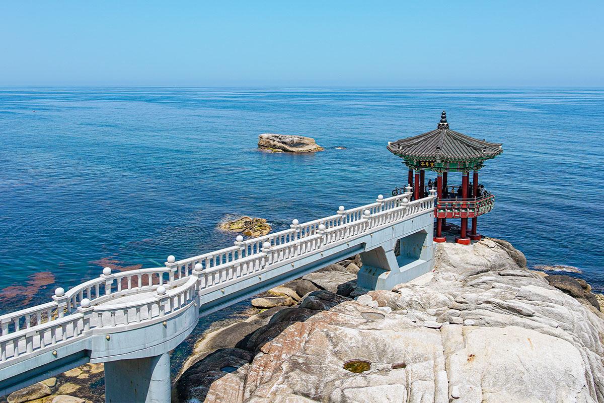 Traditional pavilion located on a rocky coastline in Sokcho, Korea.