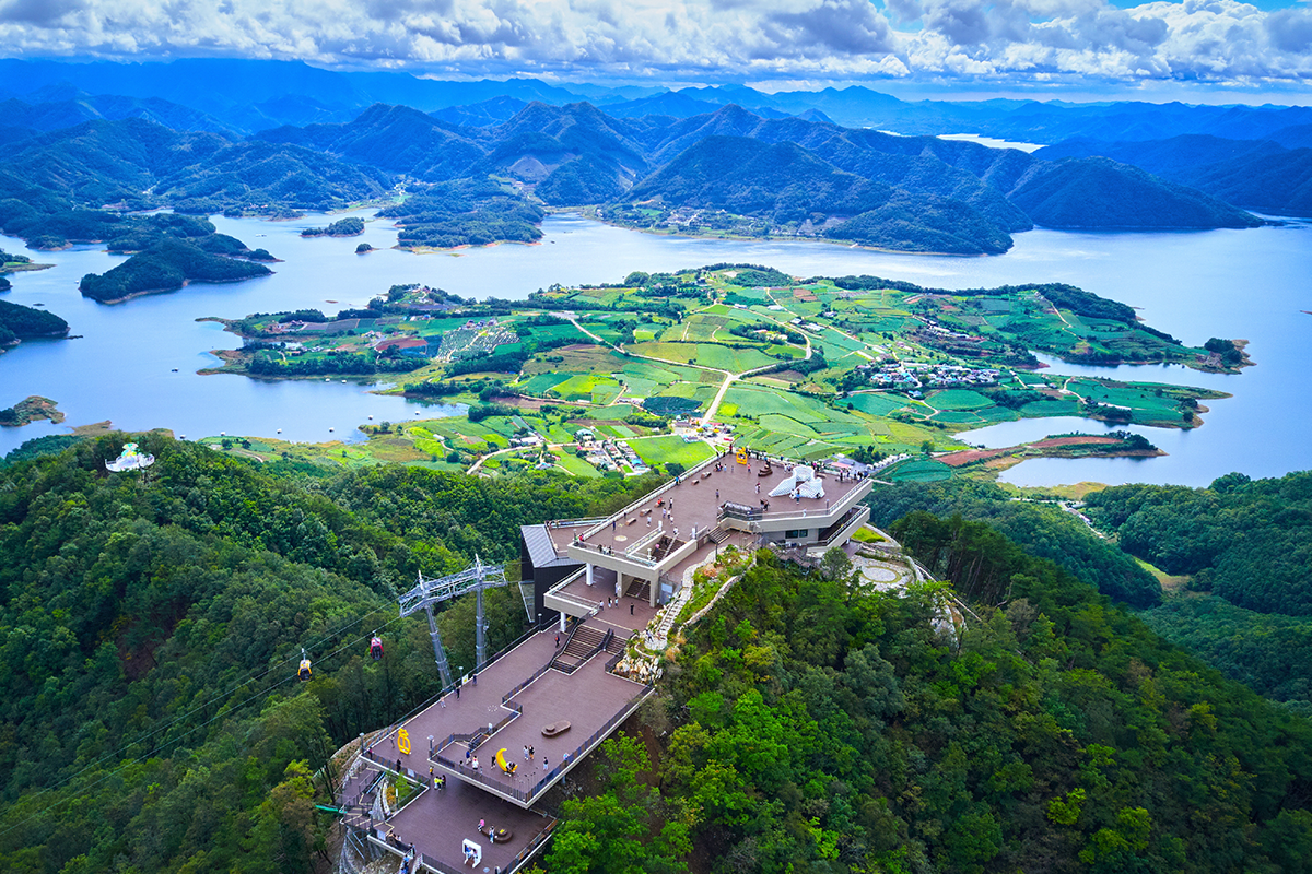 Overlooking the vast expanse of lush mountains and Cheongpung Lake from an observatory in Jecheon
