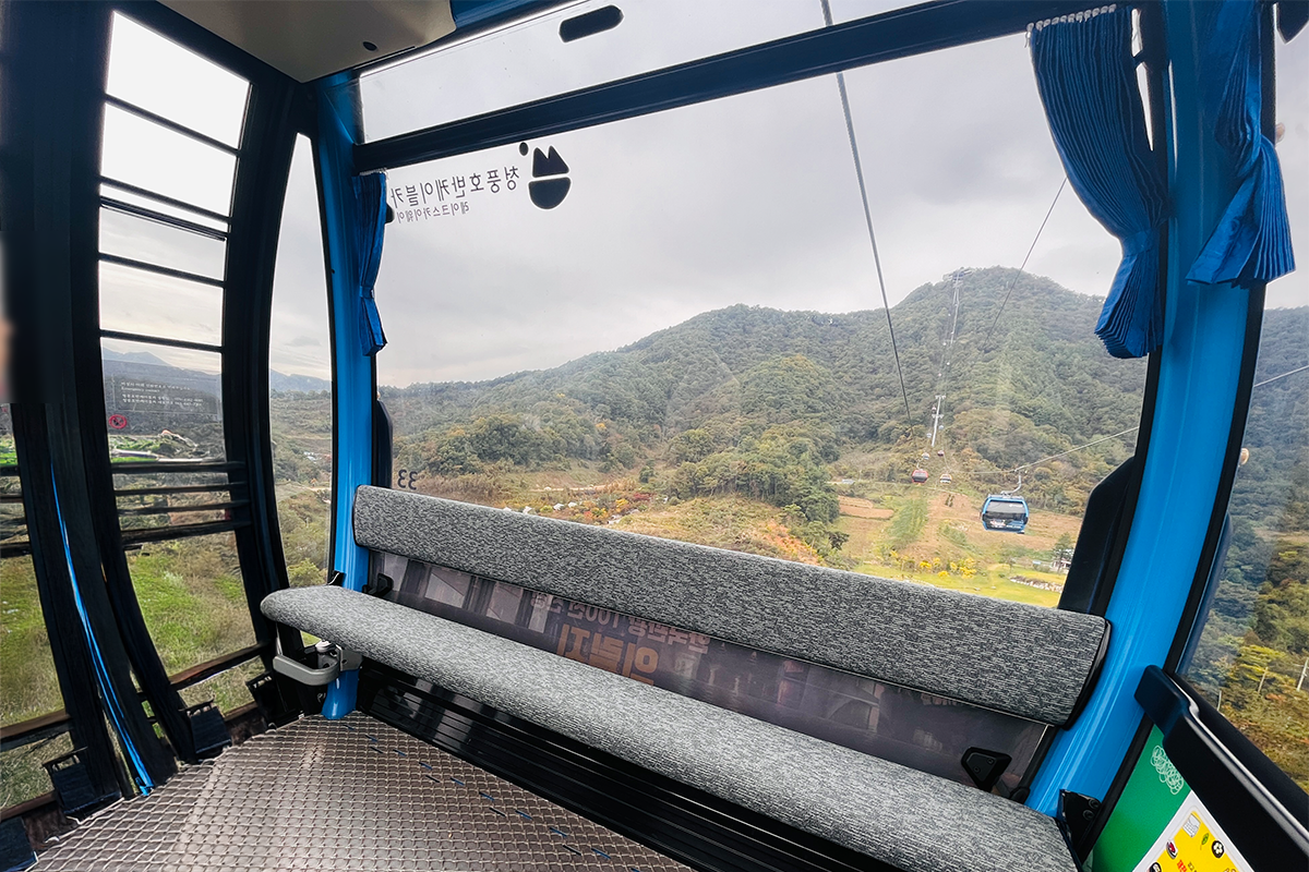 The exhilarating Cheongpung Lake monorail climbing through dense forest in Jecheon, South Korea