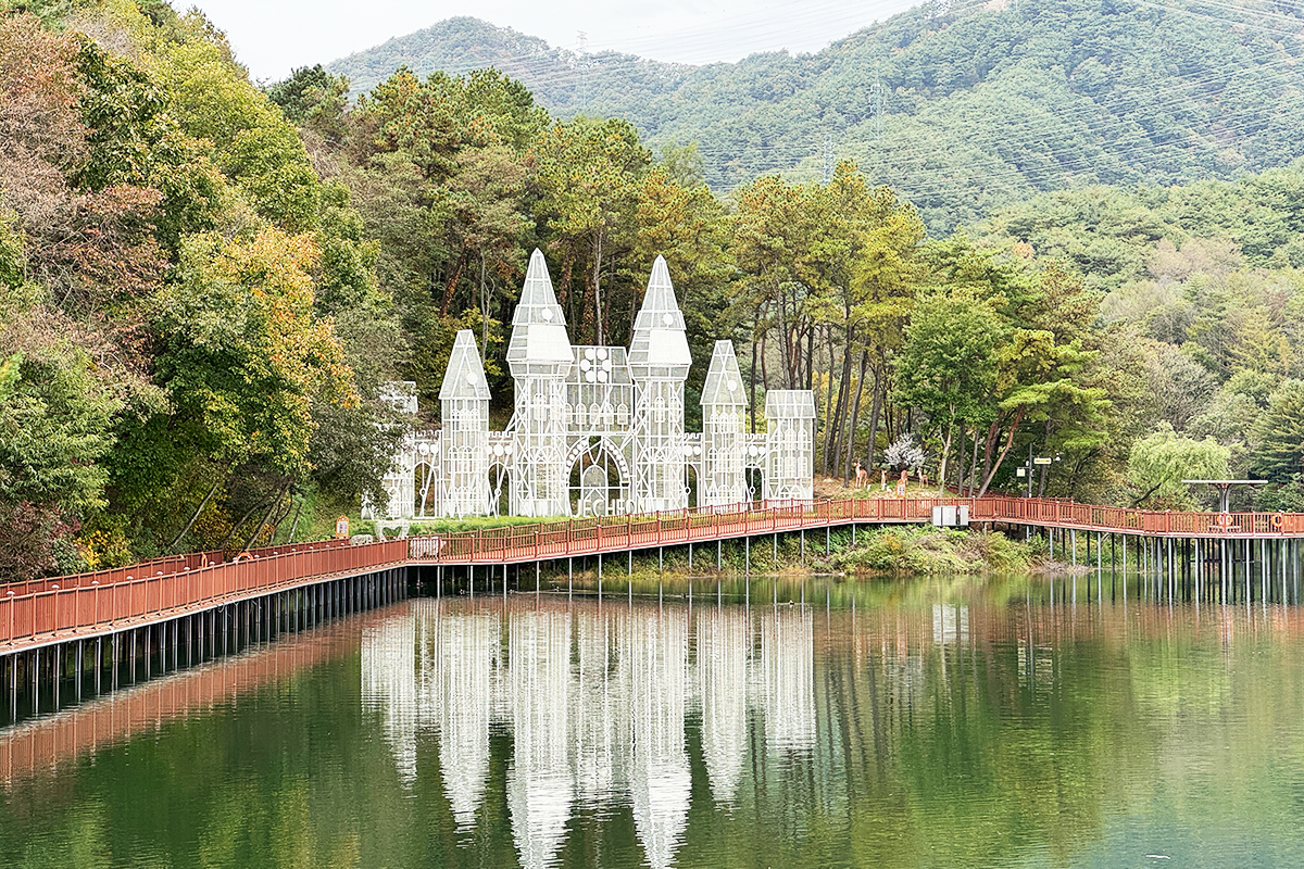 Scenic view of Biryongdam Reservoir surrounded by mountains and lush green landscapes in Jecheon