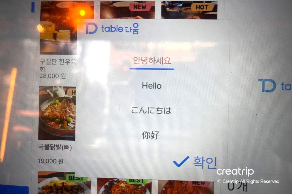 A fork lifting creamy crab roe pasta with generous cheese topping at Earl, Hongdae.