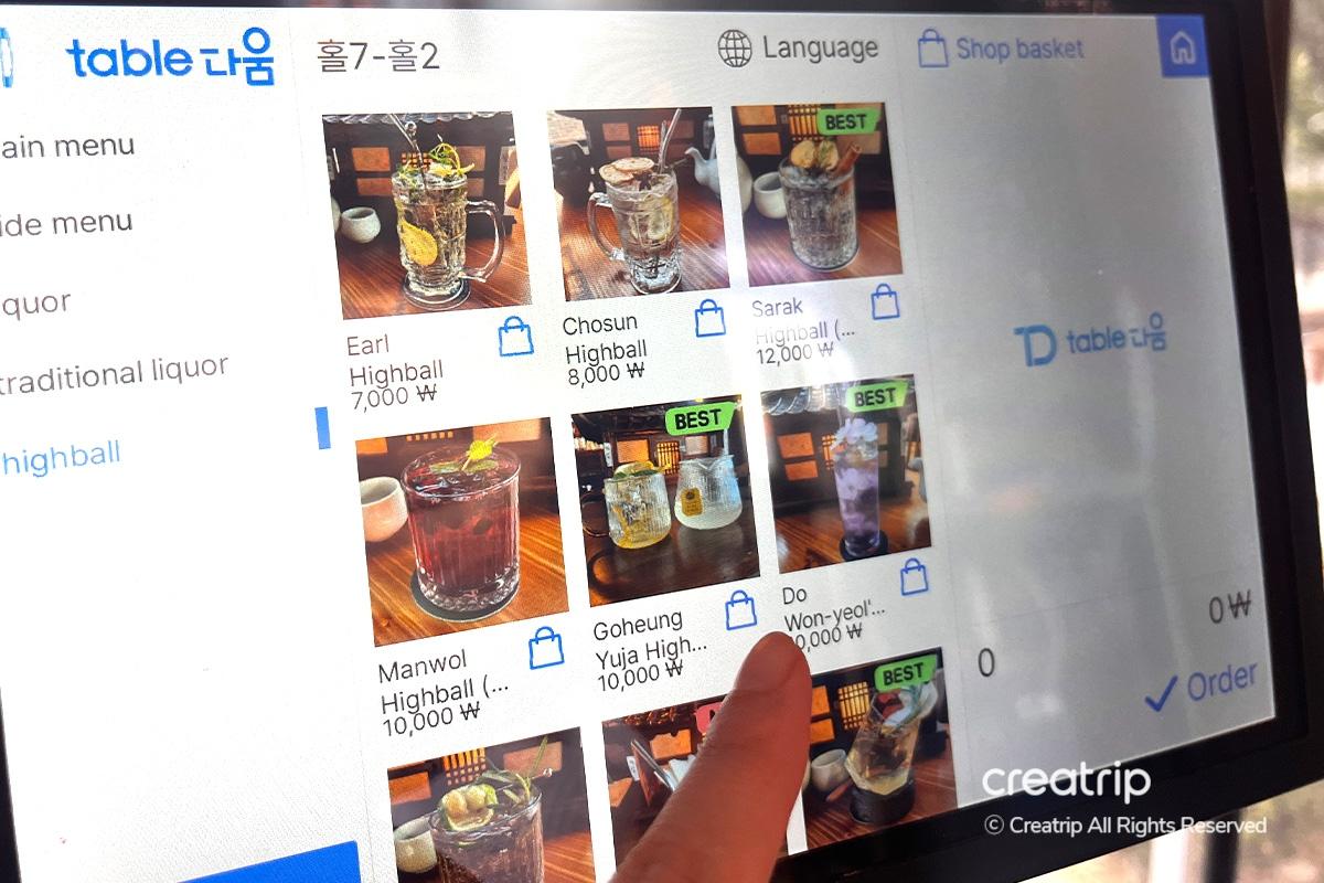 Menu interface on a tablet at Earl, showcasing local and traditional cocktail offerings.
