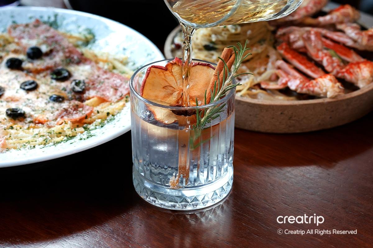 Savory grilled chicken feet on a bed of bean sprouts, vibrant and flavorful at Earl.