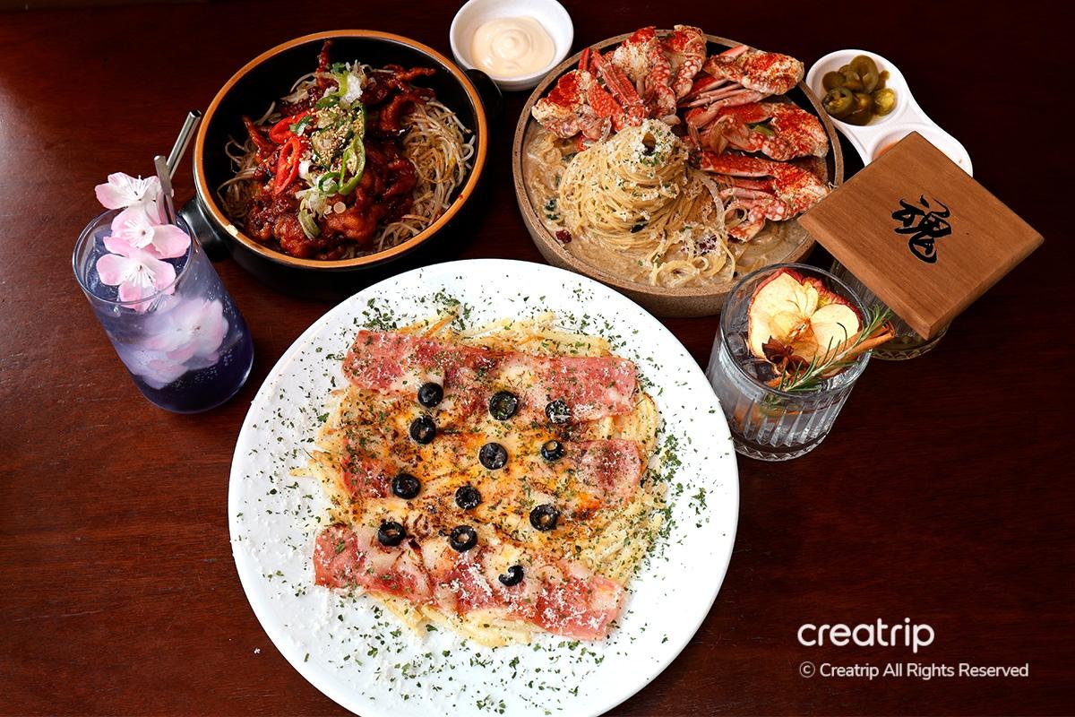 Detailed view of refreshing cocktail with citrus and rosemary, exemplifying Earl's signature drinks.