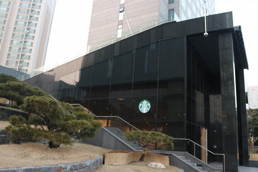 side view of building and starbucks logo of starbucks chungjeong-ro branch