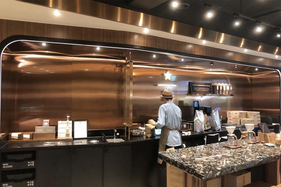 starbucks reserve bar with worker making coffee at ewha womans university branch