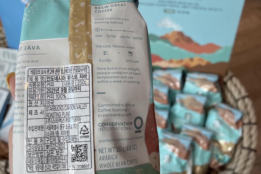 closeup on back of conservation international logo on starbucks Indonesian coffee