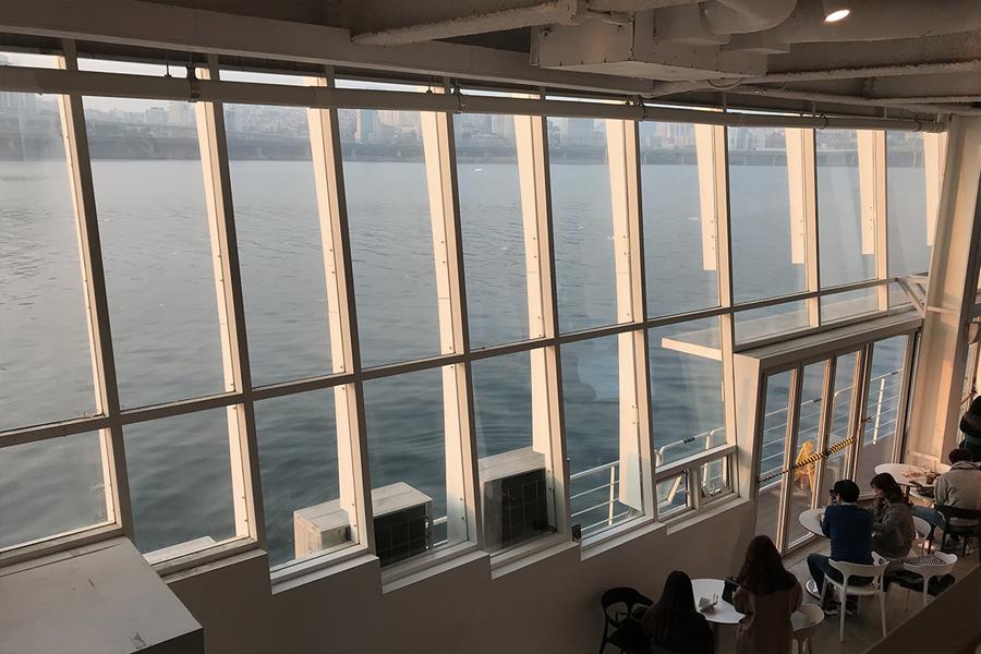 windows showing han river at starbucks seoul wave art center