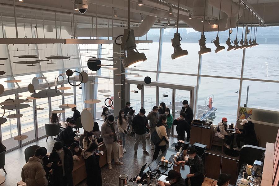 birds eye view of people at Starbucks Seoul Wave Art Center