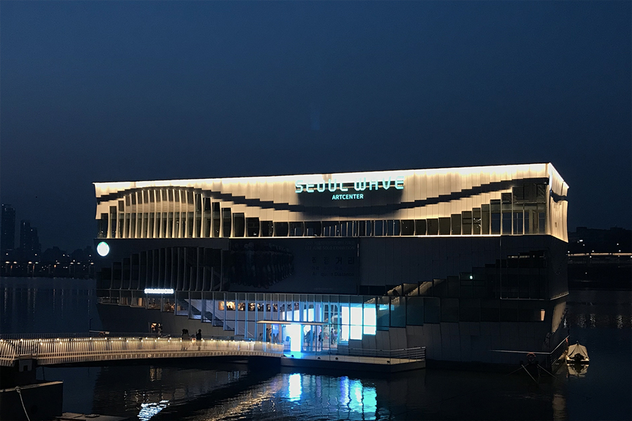Seoul Wave Art Center building lit up at night