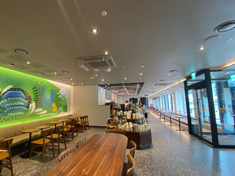 interior with chairs and table of starbucks reserve hwangudan branch