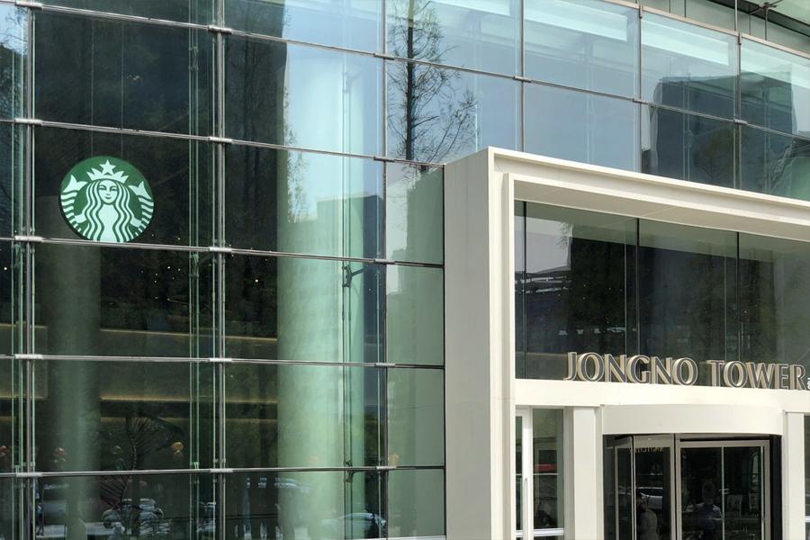 outside view of starbucks logo on window of jongno tower