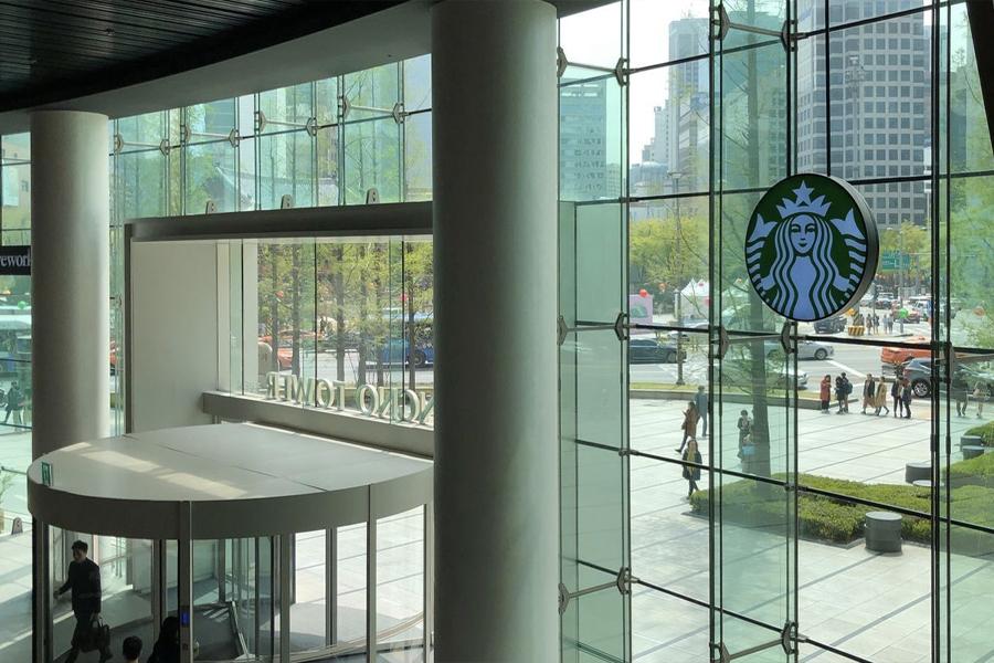 inside view of starbucks logo on window of jongno tower