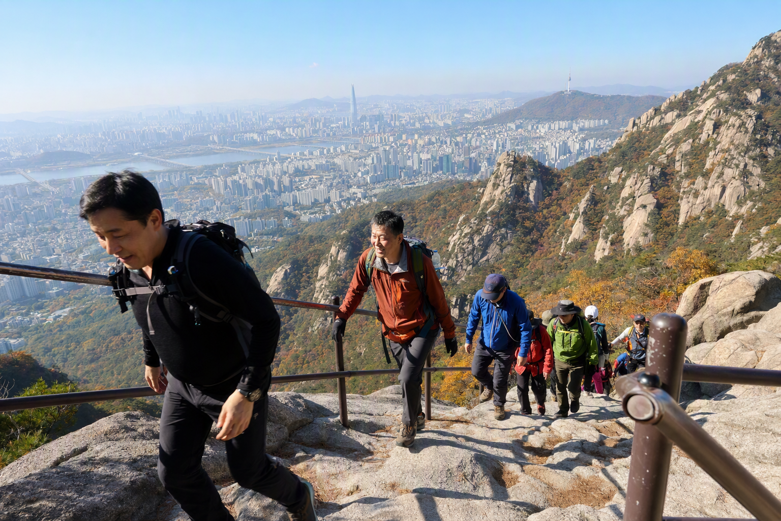 Bright, vibrant, photorealistic Bukhansan trail overlooking Seoul, rocky peak, hikers and sweeping city view under clear sky, outdoor travel mood, no Korean tex