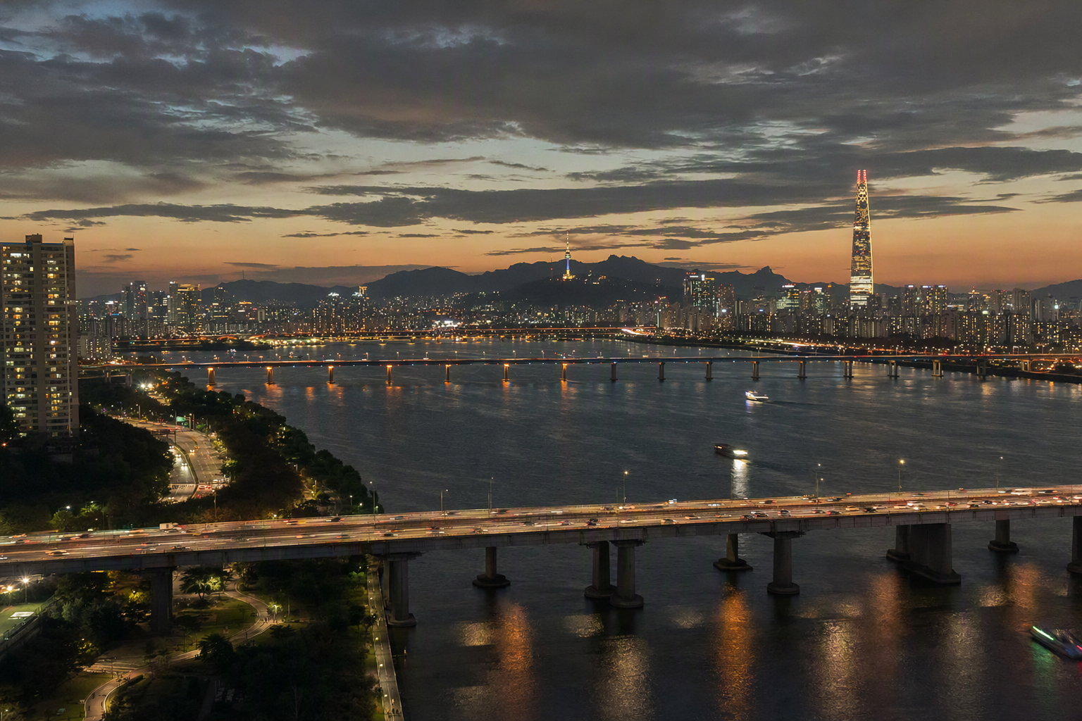 Evening view of Seoul skyline with the Han River and city lights, warm glow, photorealistic, no text