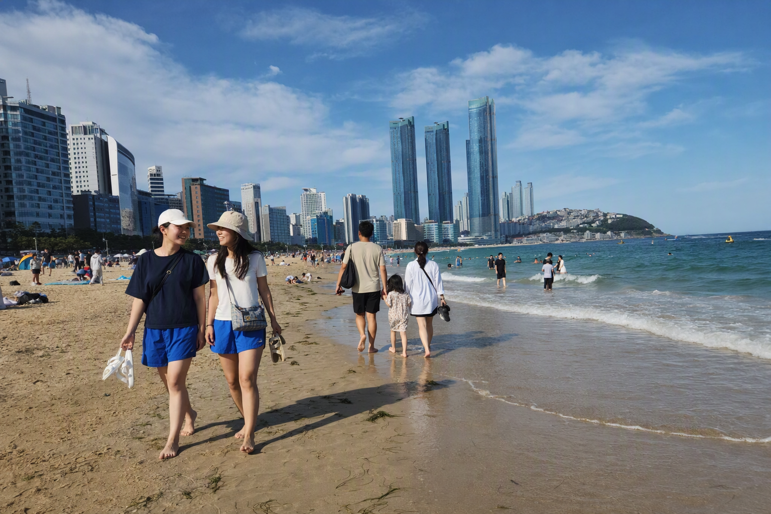 Bright vibrant photorealistic Haeundae Beach scene with white sand, turquoise water, modern skyline, relaxed travelers walking, clear summer light, no text
