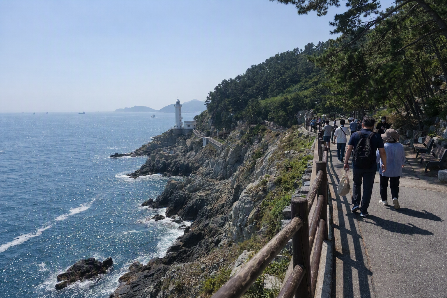 Bright vibrant photorealistic coastal cliffs at Taejongdae in Busan with deep blue sea, pine trees, walking path, clear sky, no text
