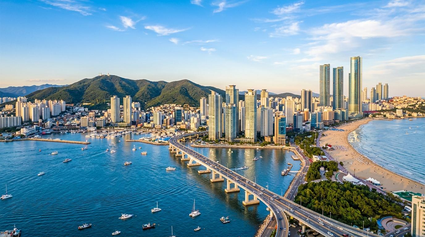 bright vibrant photorealistic panoramic view of Busan coastal skyline with blue sea, modern towers, hills, warm afternoon light, no text