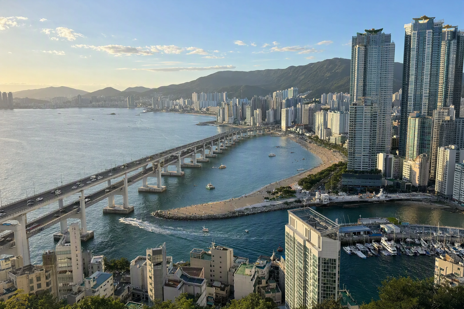 bright vibrant photorealistic panoramic view of Busan coastal skyline with blue sea, modern towers, hills, warm afternoon light, no text