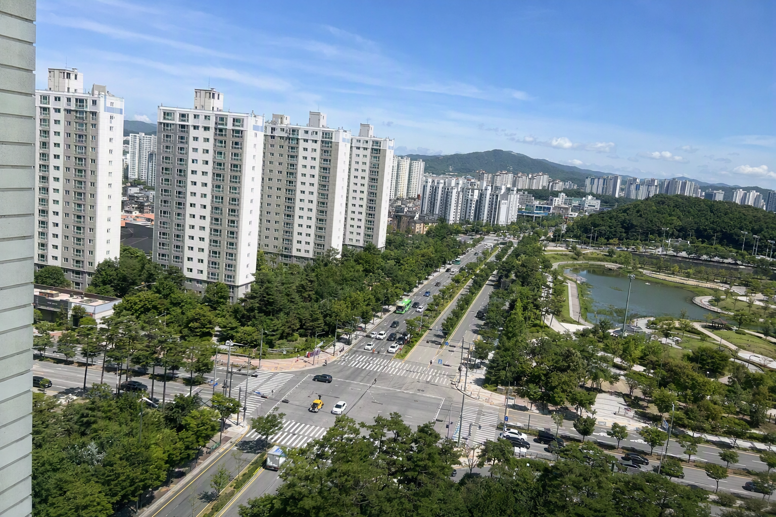 bright vibrant photorealistic view of modern high-rise apartment districts in Gyeonggi-do near Seoul, wide streets, parks, clear morning light, no text
