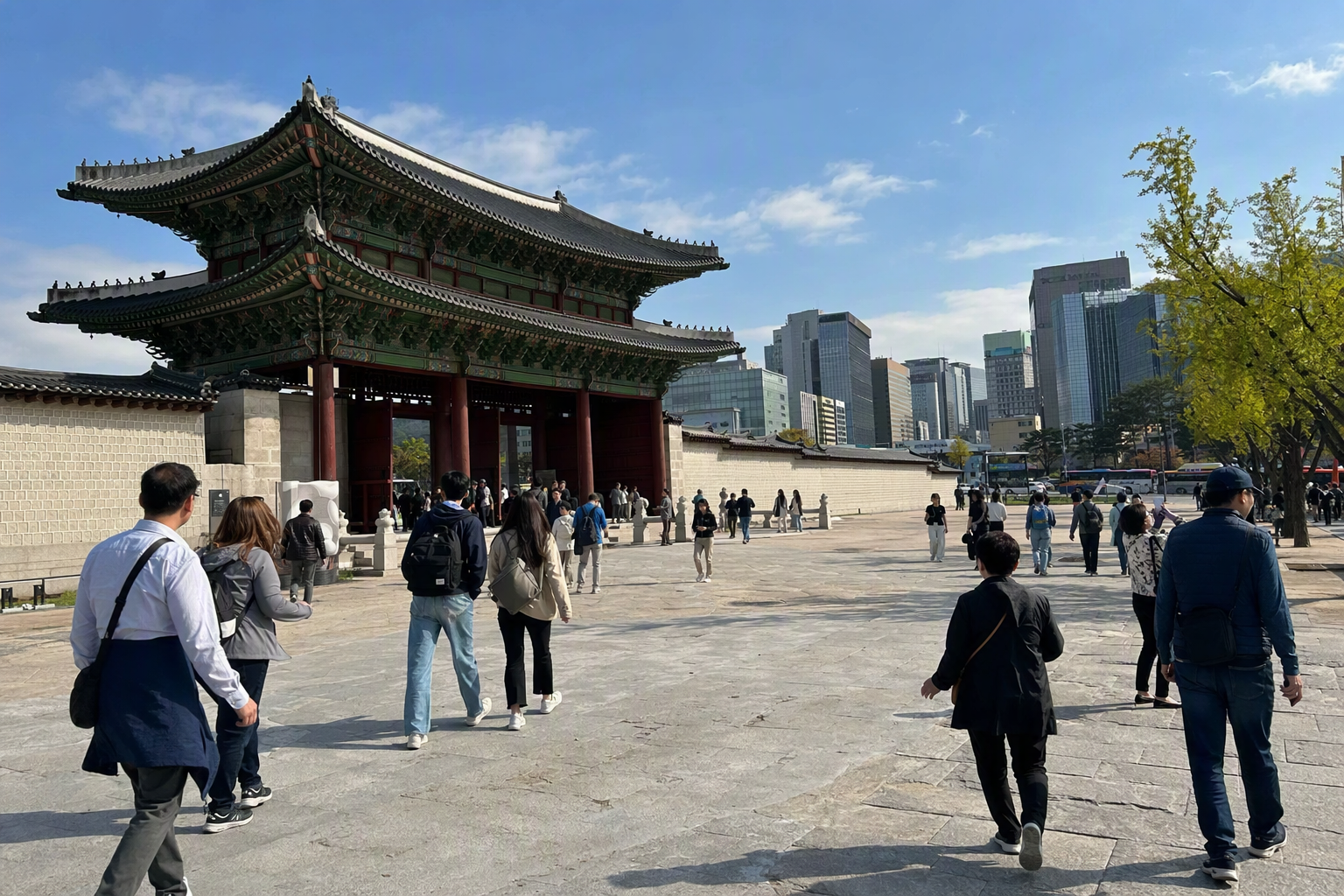 Bright vibrant photorealistic view of Gwanghwamun area with palace gates, modern city buildings, travelers walking, clear blue sky, no Korean text