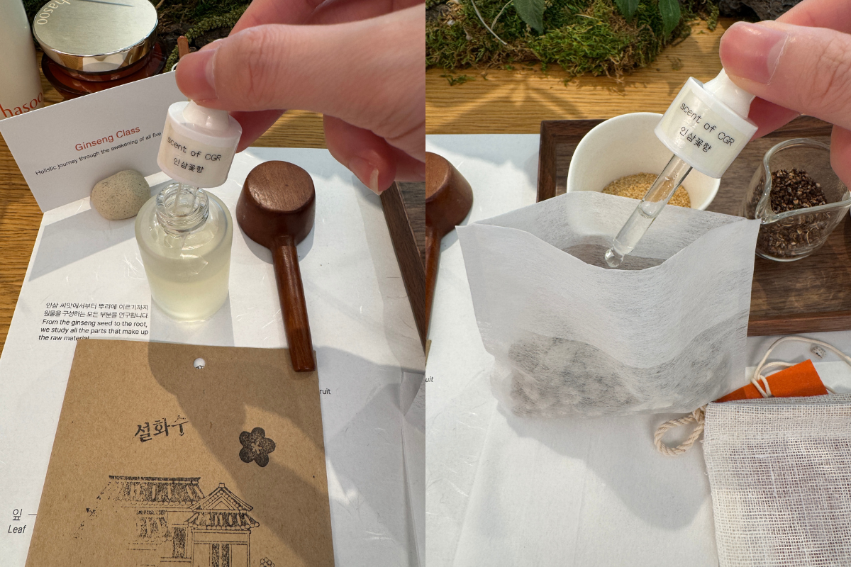 Hands demonstrating the Sulwhasoo Bukchon House ginseng DIY experience, using a dropper to add essence to a tea bag–shaped material, with a wooden spoon, clear sample bottles, and a Sulwhasoo guide card nearby.
