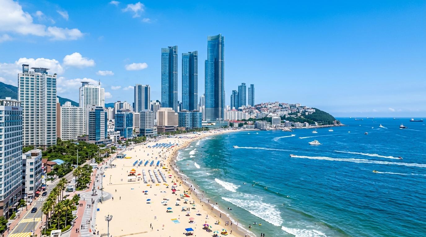 Bright vibrant photorealistic view of Busan coastline with Haeundae Beach, blue ocean, high-rise skyline, sunny weather, no Korean text