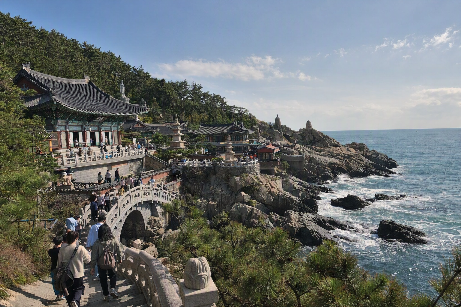 Bright vibrant photorealistic coastal Buddhist temple on rocky cliffs above blue waves near Busan, clear sky, no Korean text