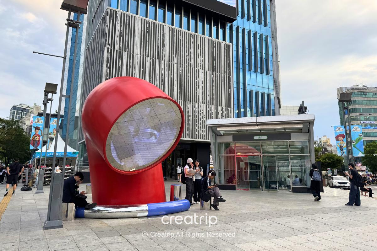 Main entrance of Hyundai Department Store Sinchon U-PLEX and the red pipe landmark