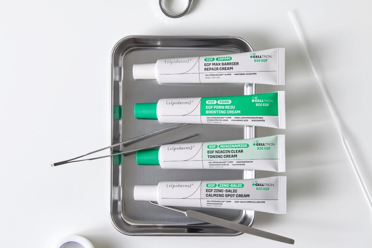 Four types of Zipiderm cream and tools lined up on a metal tray
