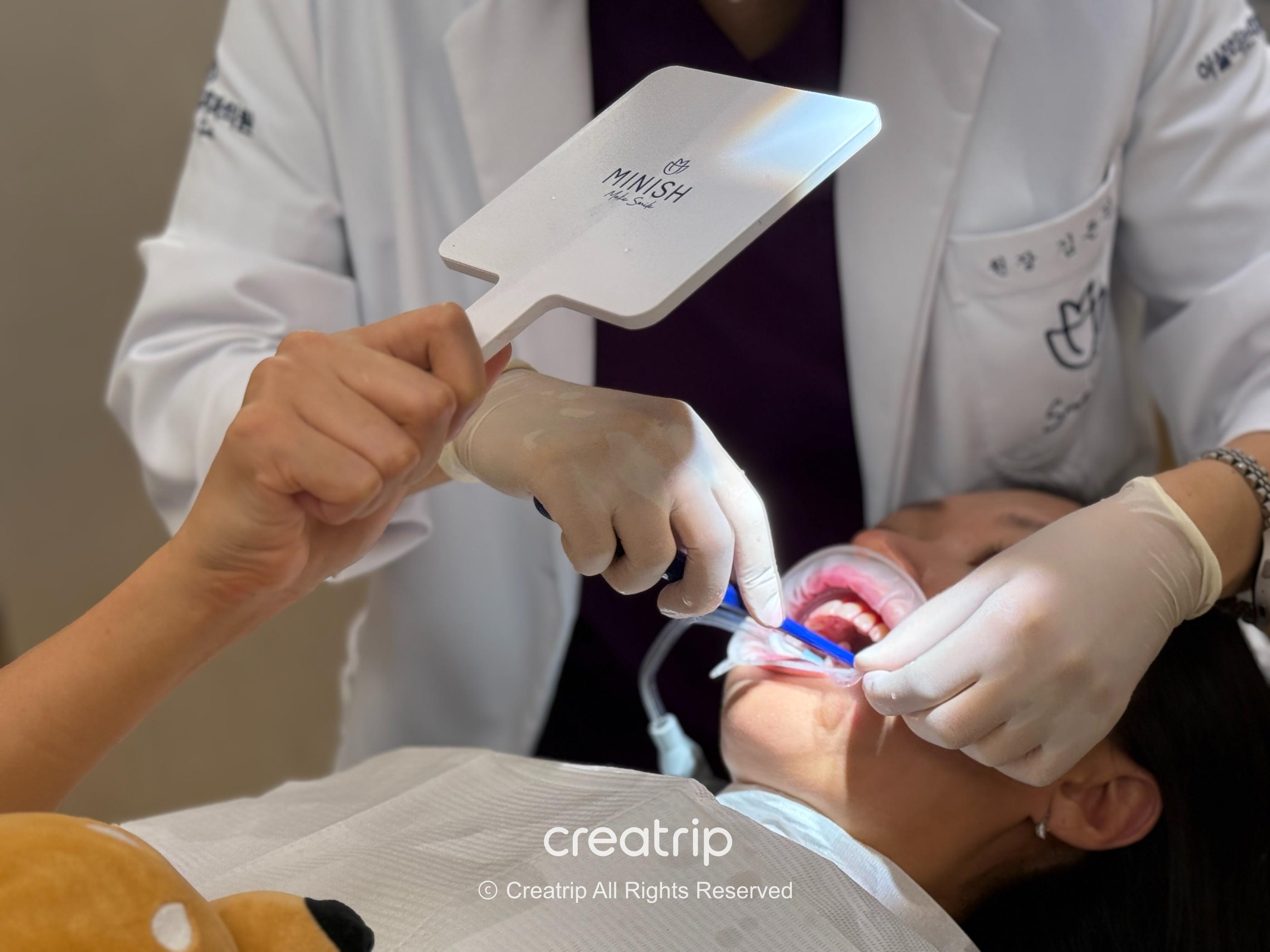 Viewing oral care with a hand mirror
