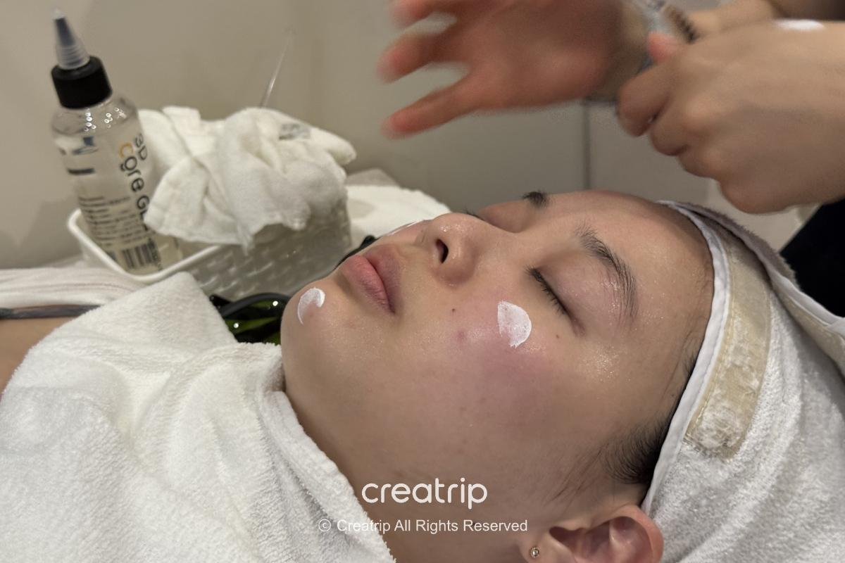 Staff member cleansing a visitor