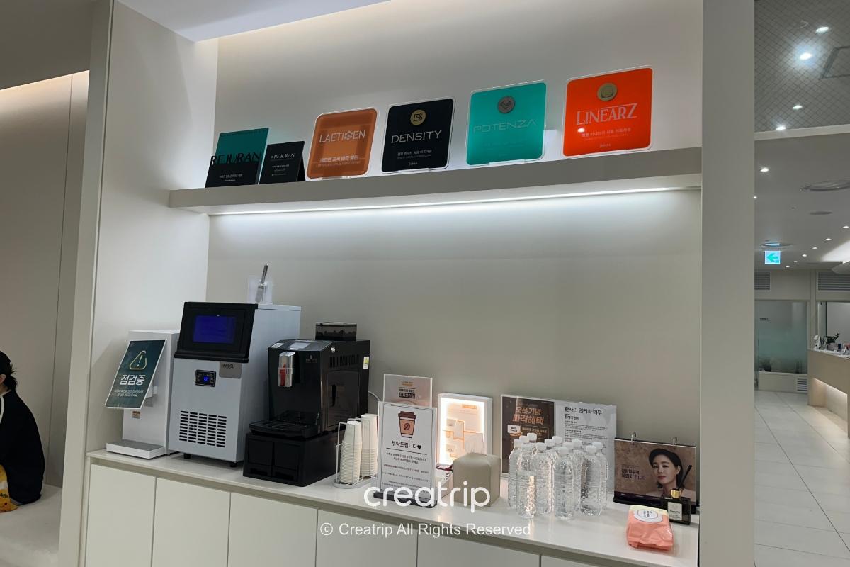 Self-service drink station with coffee machine and supplies