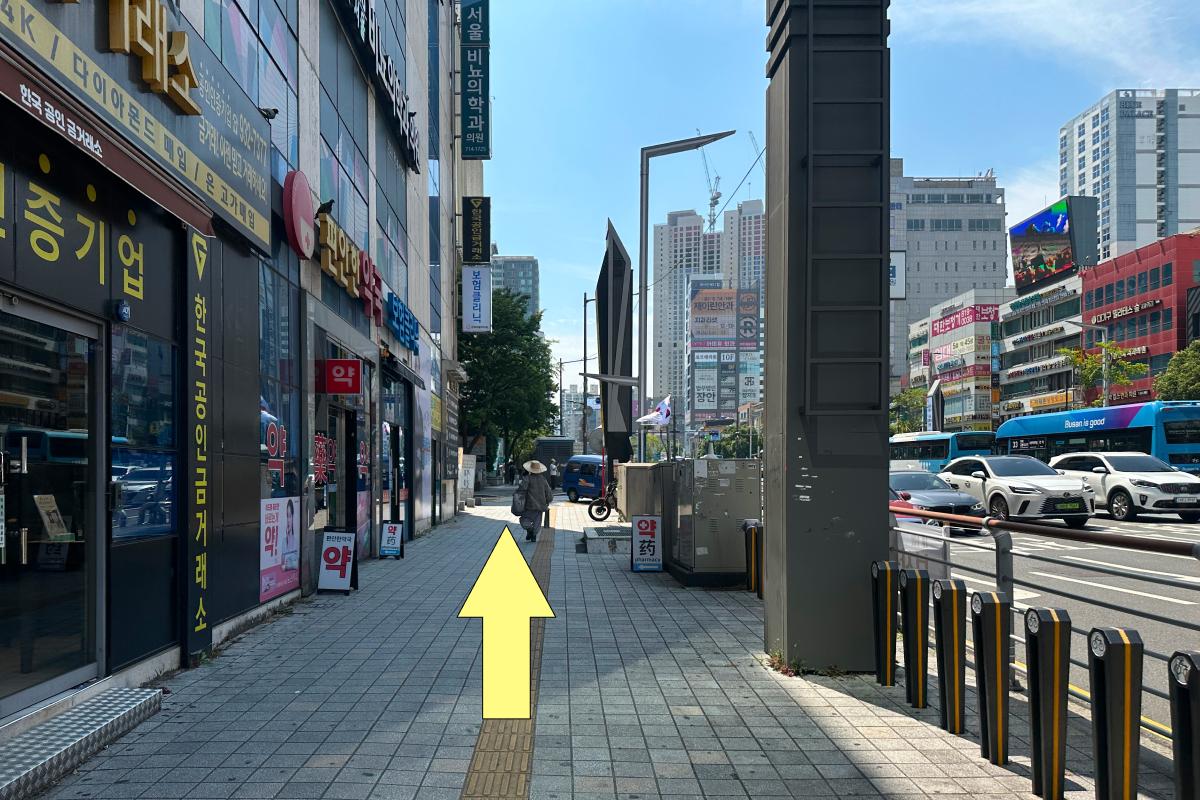 Sidewalk route continuing past Seomyeon storefronts