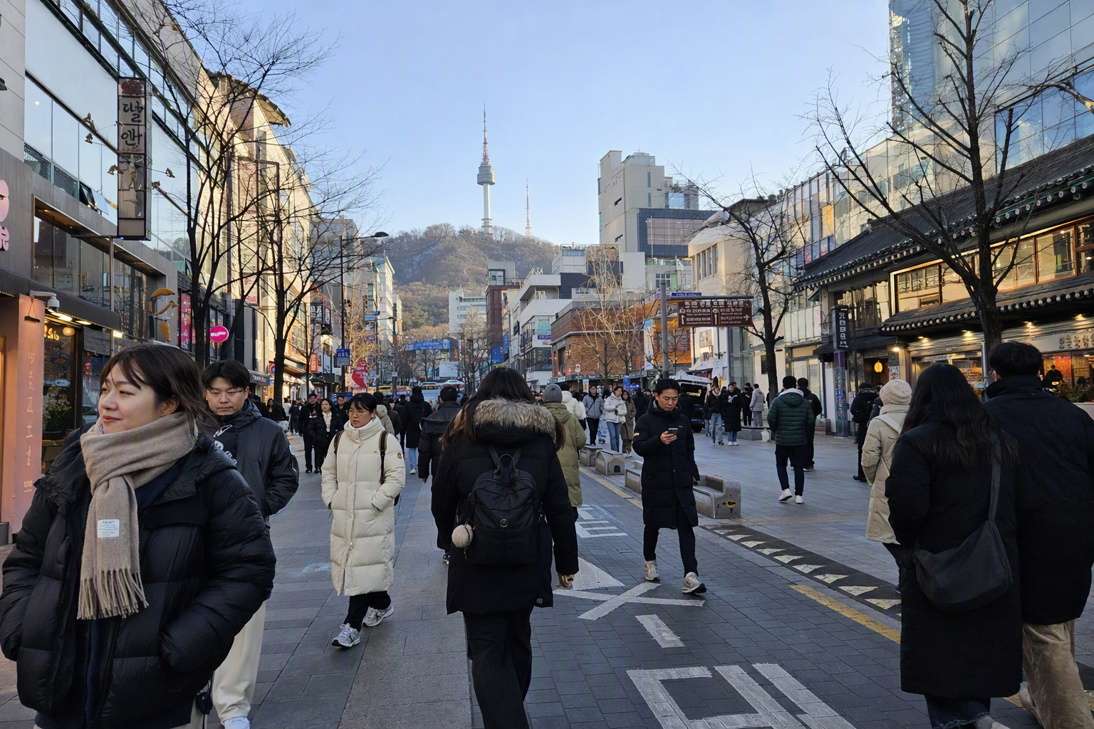 Bright vibrant photorealistic view of Seoul in early December, pale winter sunlight, people in long padded coats, dry streets, no visible text
