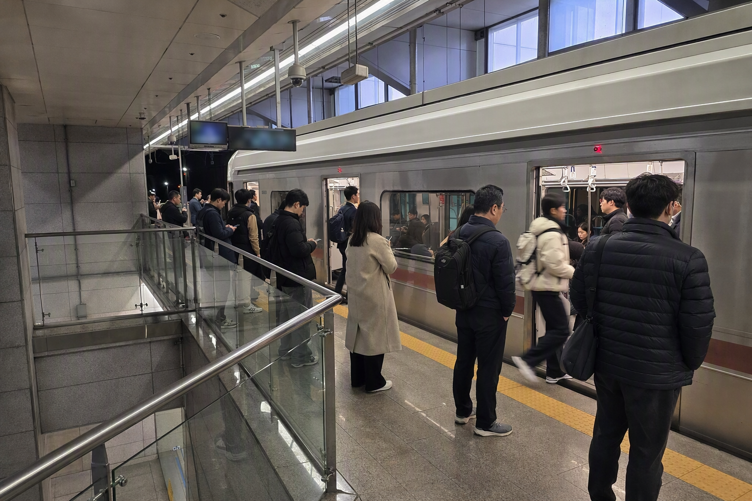 Bright photorealistic modern underground rail platform with sleek train, commuters waiting calmly, polished floors, no readable text