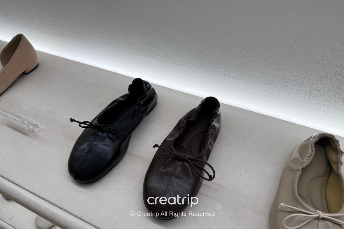 Seasonal sneakers and lightweight women’s shoes displayed in store
