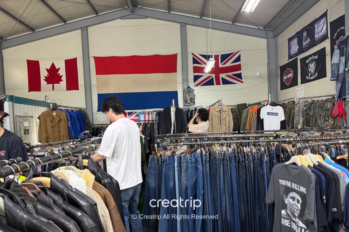 Freedy — Flags displayed above rows of clothing