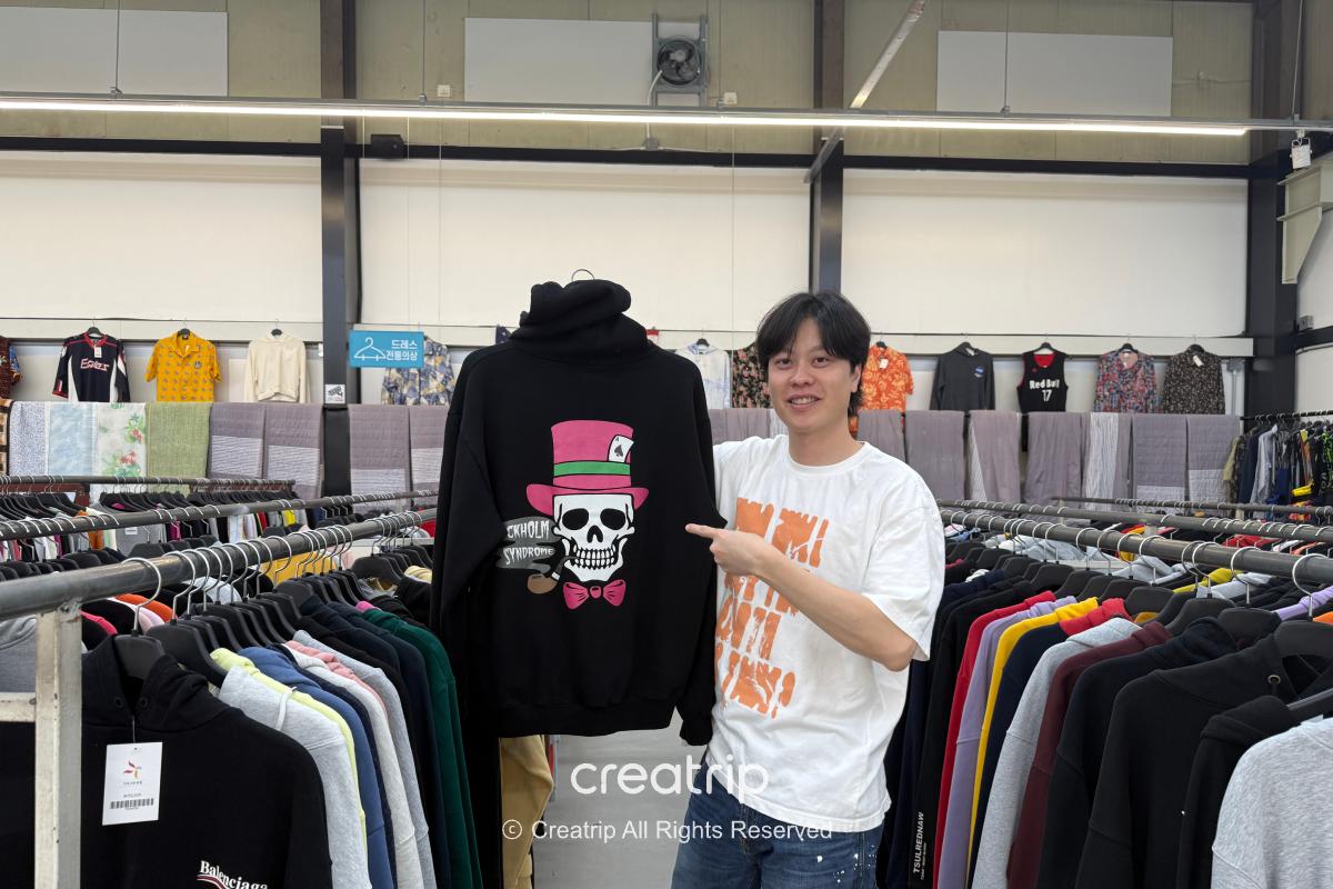 Freedy — Holding up a black printed top