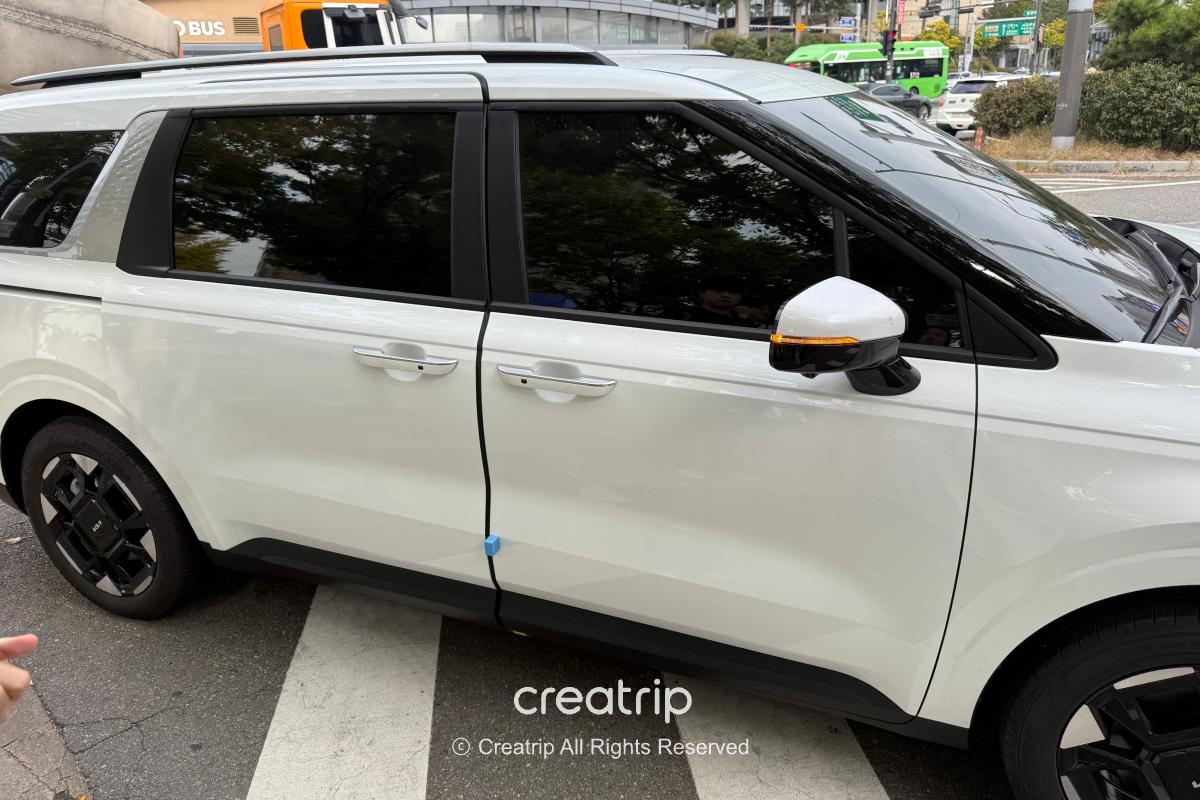 Freedy — White tour van parked outside