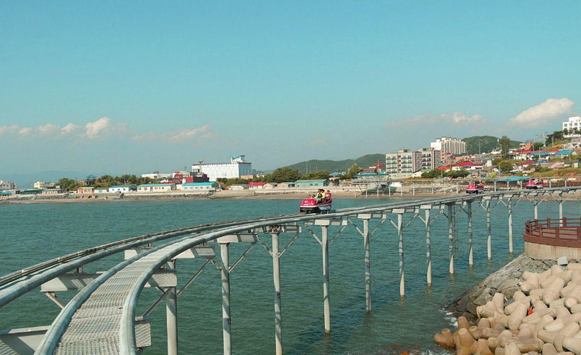Riders enjoying a thrilling Skybike ride on the high-altitude tracks at Daechon Beach.