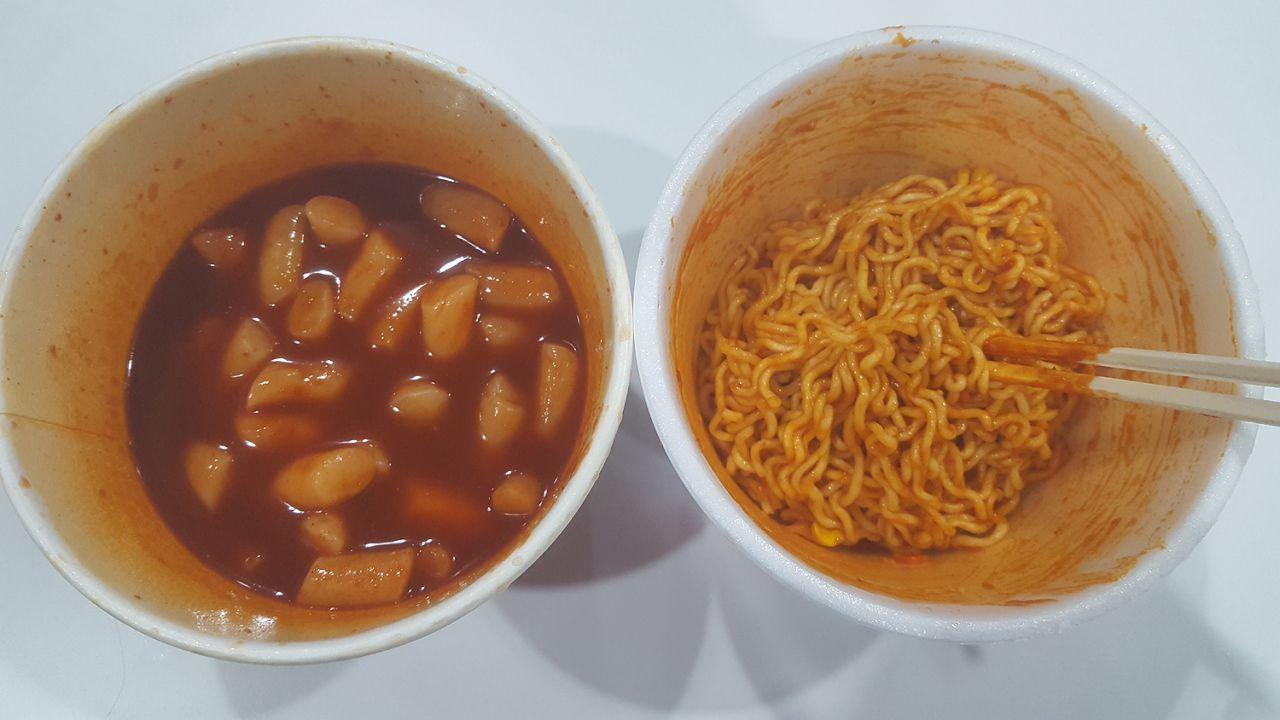 Spicy rice cakes in sauce and mixed noodles, ready to be combined into a flavorful Mark meal dish.