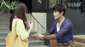 Scene from a Korean drama depicting romantic interaction.